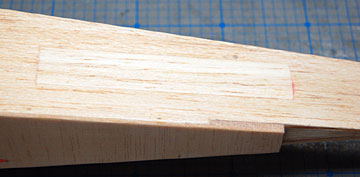 A piece of balsa was cut to fill the area where the rudder pushrod was located.