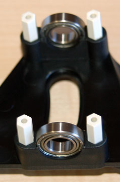Main shaft bearings mounted in a frame half.