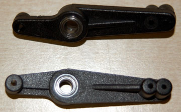 Press the bearings into the flybar control levers.
