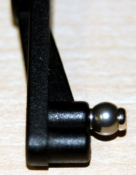 Thread a ball onto the inside hole of the flybar control lever with the ball shoulder against the lever.