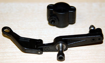 Flybar control lever assembly is bolted to the washout base.