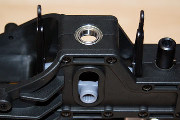 Place the elevator control arm assembly inside the frame.