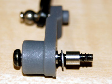 Place the long collar inside the elevator control lever, insert the M3 x 18 self-tapping screw, slide on a washer and then slide on the short collar.
