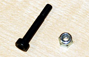 Socket bolt and lock nut that holds main shaft in place.