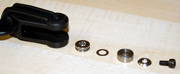 Parts that go inside the main rotor pitch housing shown in the order they are inserted.