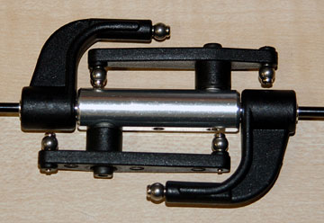 Tighten the flybar control arms to the flybar rod.  Add the mixing levers to the seesaw hub.