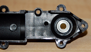 Insert the bearing into the right tail unit housing.