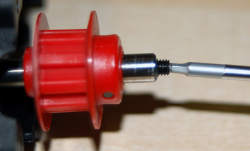 Apply Loctite in the tail rotor shaft, insert the set screw and tighten it against the pin.