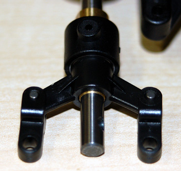 Place the tail pitch control links over the fork and insert the pins.