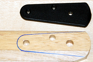 Trace around the blade grip using a Sharpie marker.  Remove the grip and repeat for the other side of the blade.