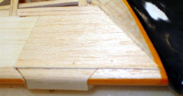 The gap is filled with water base glue which will expand the wood strip to fill the gap.