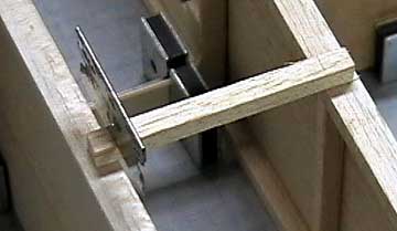 Cross-braces are fit in the aft fuselage to help keep it straight.  The cross braces also support the decking.