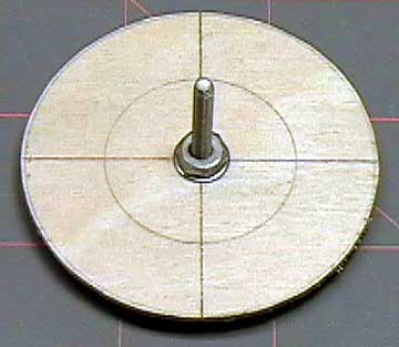 Thread a bolt through the center hole and use a nut to tighten it securely.