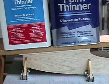 Weight is again used to hold the decking while it dries.