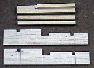 The pre-cut servo rail supports and servo rails.