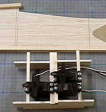 The servos mounted to the rails.