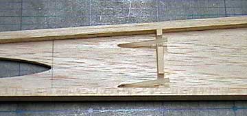 Short pieces of nylon tubing are glued into the pull-pull exits.