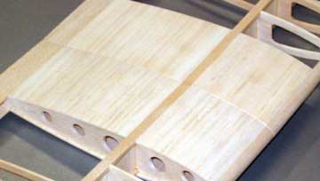 Use good sanding blocks and work on specific areas until both panels are a close match.