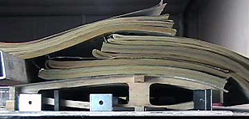 Adjustments are necessary because the magazines do not fully conform to the wing.