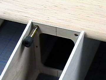 Use the holes in the former to guide the cutter.