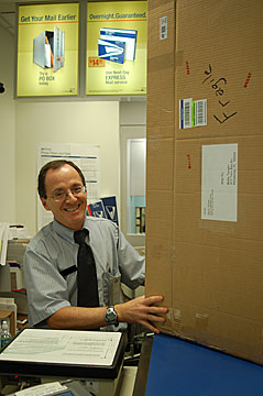 Turn the crate over to the friendliest postal employee.  Offer to give him a quarter if he takes care of it respectfully.