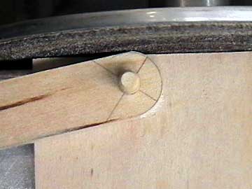 A fixture and a disk sander ensure consistency and speeds things up.