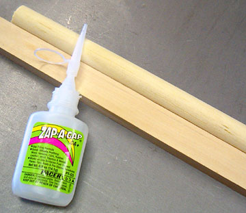 To saw a dowel along its length, glue it to a block.