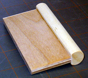 Center the handle on the dowel and glue it in place.
