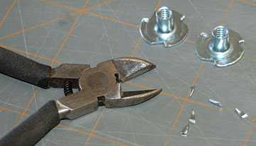 Cut the prongs from both blind nuts.