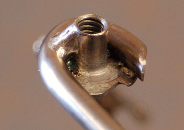 A solder fillet around the blind nut.
