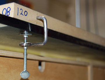 The blind nut helps prevent the clamp from racking over as it's tightened.
