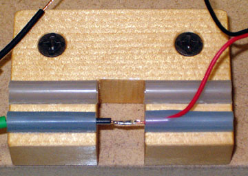 Solder the wires together using rosin core solder.