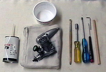 Tools used to disassemble a model aircraft engine.