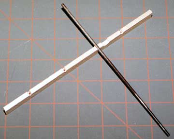 A round file is used to enlarge the area for the hinge pivot point.