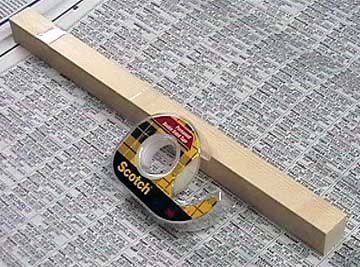 Attach the part to something that allows excess cloth to overhang the edges. Attaching small parts to a handle makes them easier to work with.
