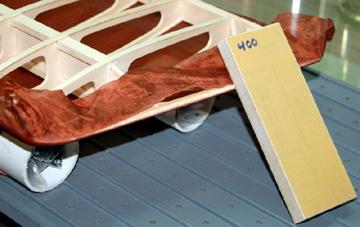 Use sandpaper to cut through the silk at the tips.