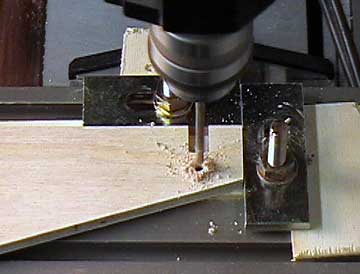 Drill the holes for the vertical press mounting bolts.